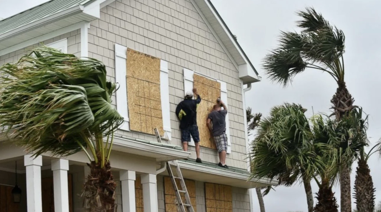 Family reviewing hurricane preparedness plan